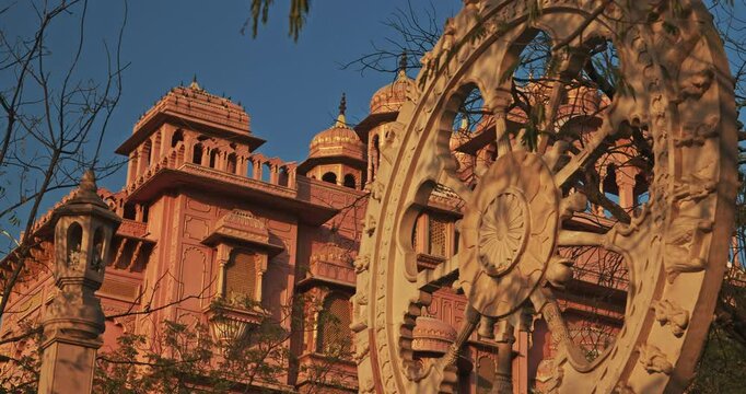 Jaipur, Rajasthan, India. Eternal Wheel Of Samsara And Patrika Gate At Jawahar Circle On Background. Old Pink City. Travel To India. Traditional Rajasthani Style Of Architecture. Jaipur City Landmark