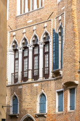Obraz premium facade with traditional Venetian windows an old house in Venice