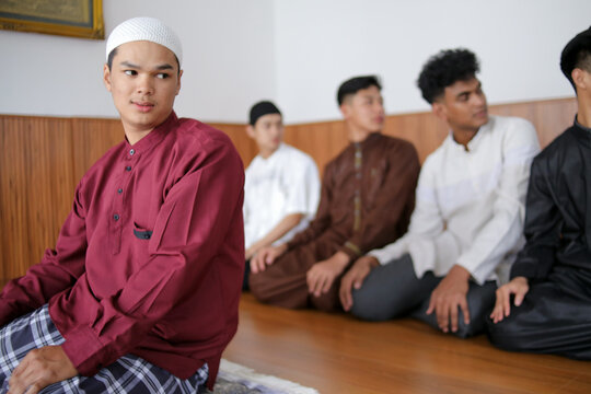 Young Muslim People Turning Head Into The Left To Finish Salah Pray At The Mosque