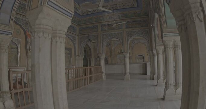 POV view on Old-painted Walls. Frescoes On Wall Of Hanuman Temple In Jaipur, India. Ungraded C LOG 2 Religious Motifs From Life Of Hanuman Are Painted. Monkey-like Deity, Son Of Wind God Vayu. Hanuman