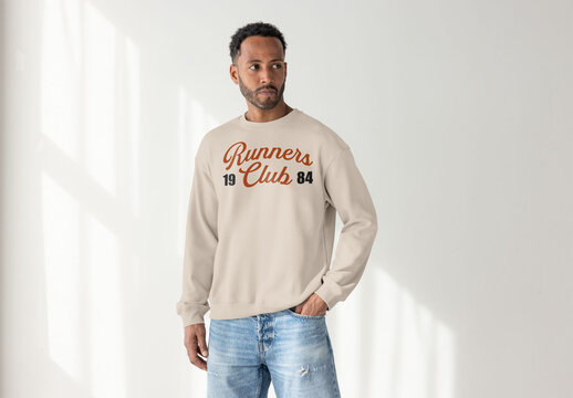 Mockup of Black Man in Casual Sweater Looking Thoughtfully Away