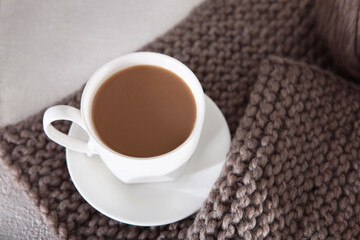 Cup of coffee and knitting. Knitting with needles as hobby. Skein of thread. Knitting from wool yarn.