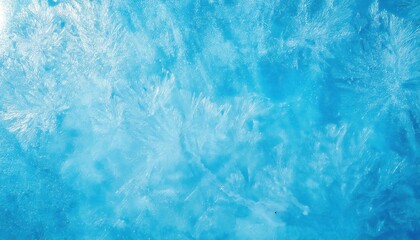 Obraz premium textured frozen ice surface with intricate frost patterns in vibrant blue tones, perfect for winter themed designs and background