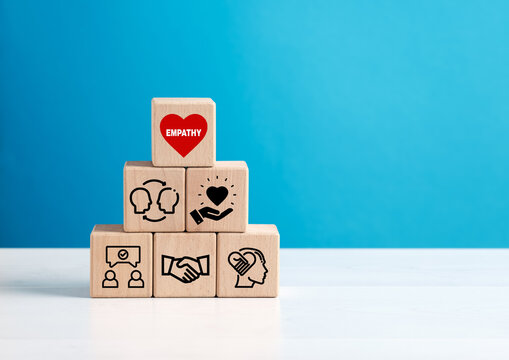 Building empathy: wooden cubes showing how to develop emotional intelligence