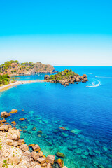 Isola Bella is small island near Taormina, Sicily, Italy.  Beach in azure waters of Ionian Sea.