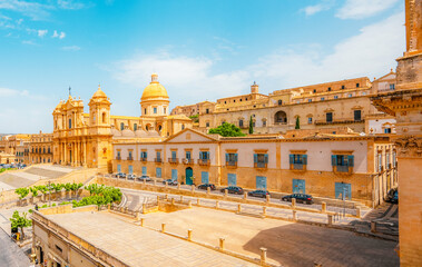 view in Noto, with the Basilica Minore di San Nicolo and Palazzo Ducezio, Sicily, Italy. Chiesa di...