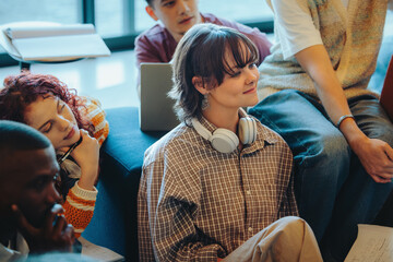 Engaged students listening during an education session and sharing ideas in a modern learning...