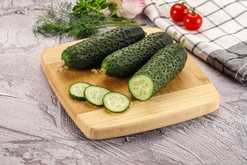 Raw green cucumbers with slices