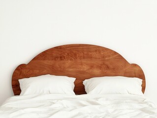 Cozy bed with wooden headboard and fluffy white pillows.