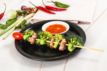 Thai Street foof satay with bacon and broccoli