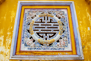 Ceramic Decorative Art On The Wall Of A Palace In Hue Imperial Citadel. The Imperial Citadel Of Hue, A UNESCO Cultural Heritage Is A Major Tourist Destination In Vietnam.