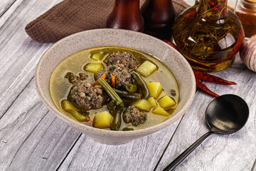 Soup with beef meatballs and vegetables