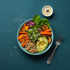 Healthy Vegan Buddha Bowl with Avocado, Quinoa, and Roasted Vegetables
