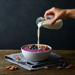 Healthy Breakfast Bowl with Granola, Blueberries, and Almond Milk