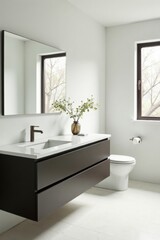 Modern minimalist bathroom design featuring a sleek dark vanity, a wall-mounted toilet, and a large mirror reflecting natural light from a window