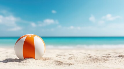 Obraz premium A vibrant beach ball rests on a sunlit sandy beach, capturing the essence of summer fun, relaxation, and the carefree joy of beachside activities by the ocean.
