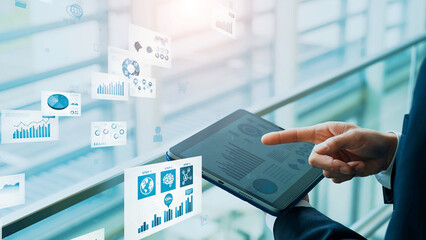 Businessman using tablet and electronic documents concept