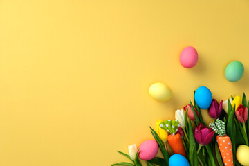 Colorful Easter eggs and spring tulips on a yellow background. Happy Easter greeting card template.