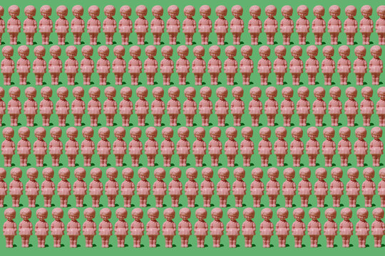 Pattern of old-fashioned pink dolls in a repetitive formation on a green background