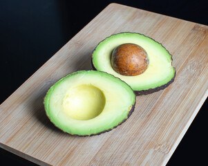 avocado on a wooden plate