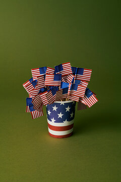 Disposable cup with American flags in a studio setting symbolizing patriotism