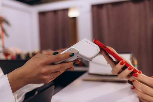 Close-Up of Contactless Smartphone Payment at a Modern Retail Counter