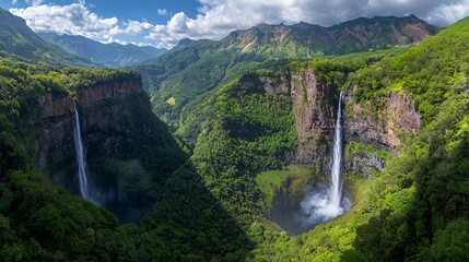 Dual Waterfalls Cascading Down Lush Green Cliffs in a Tropical Valley