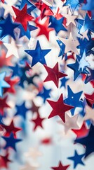 Obraz premium Stars in celebration: Festive stars in red, white, and blue cascade, creating a dynamic, patriotic display, symbolizing national pride.