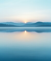 Fototapeta premium Majestic sunrise over fog-covered lake surrounded by mountains