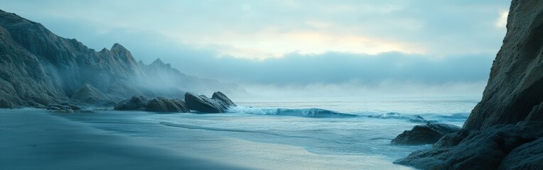 Obraz premium Misty shoreline with fog rolling over rocky beach landscape