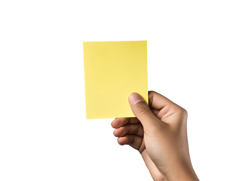 hand holding yellow sticky note