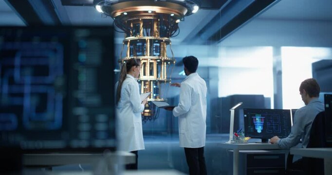 Young Engineers Inspecting Quantum Computer Processor, Analyzing Advanced AI Data on a Tablet Computer in a Research Center. Diverse Team Focusing on Innovative Hardware and Technology