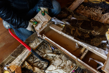 Getting rid of old things. Disassembling an old sofa in the attic.