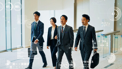 オフィスを歩くビジネスグループと統計データ