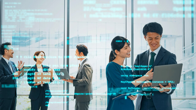 オフィスで会議する人々とデジタルテクノロジー