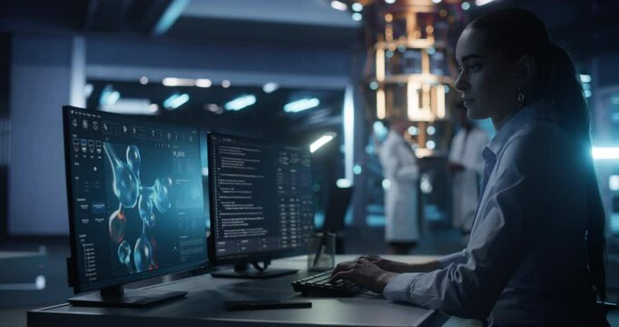 Female Biochemist Working in Modern Office on a Desktop Computer with Molecular Modelling Software. Genetic Healthcare Engineer Designing New Drug Molecules to Combat Bacteria