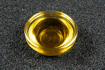 Unrefined cold pressed sesame oil in a glass bowl.