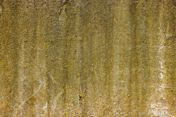 rough concrete wall with yellow stains