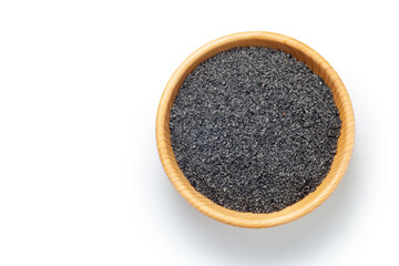 Black sesame powder in wooden bowl on white background, Top view