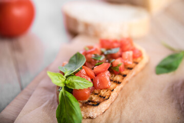Bruschetta with tomatoes and basil prepared for breakfast