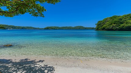 Fototapeta premium Tranquil Tropical Beach Scene: Clear Turquoise Water, White Sand, and Lush Green Islands under a Bright Blue Sky