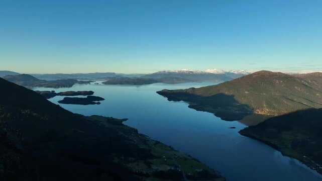 Mountain aerial at sunset in western Norway with views of Bjoa Fjord, Skanevik Fjord, and islands