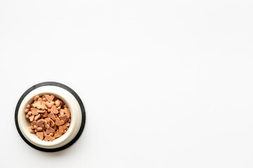 Food and treats for pets - biscuits in a shape of heart in a bowl