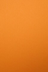 Orange textured sheet background. Empty space for text