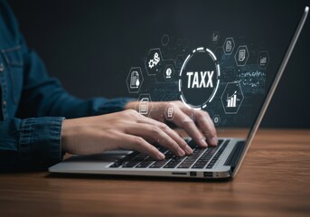 Hands typing on laptop with digital tax graphics overlay.
