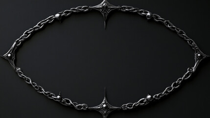ornate dark metal chain with star-shaped spikes forming oval on black background

