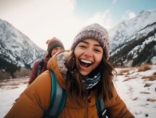 happy Friends enjoying snow on background of mountains. having fun spending winter vacation in mountains Travel in winter