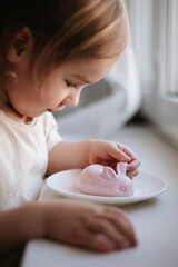 little girl and healthy easter sweets - jelly bunny