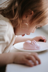 little girl and healthy easter sweets - jelly bunny