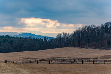 Forests, fields, and mountains on the horizon in early spring